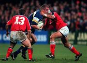 3 November 2000; Victor Costello of Leinster in action against Killian Keane and John Kelly of Munster during the Guinness Interprovincial Championship match between Leinster and Munster at Donnybrook in Dublin. Photo by Brendan Moran/Sportsfile