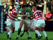 11 November 2000; Shane Horgan of Ireland is tackled by Keiji Hirose of Japan during the International Rugby friendly match between Ireland and Japan at Lansdowne Road in Dublin. Photo by Ray Lohan/Sportsfile