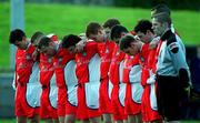 12 November 2000; St Patricks Athletic team, bow their heads for a minute silence before the game against UCD in respect of the recent death of Harry Boland who served as captain, trainer and groundmans during the Eircom League Premier Division match between St Patricks Athletic and University College Dublin at Belfield in Dublin. Photo by Pat Murphy/Sportsfile