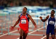 23 September 2000; Cuba's Anier Garcia celebrates after winning gold in the mens 110m hurdles during the Sydney Olympics at Sydney Olympic Park in Sydney, Australia. Photo by Brendan Moran/Sportsfile