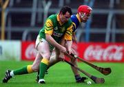 30 October 2000; Anthony Foley of Patrickswell in action against Michael O'Meara of Toomevara during the AIB Munster Club Hurling Championship match between Patrickswell and Toomevara at Semple Stadium in Thurles, Tipperary. Photo by Ray McManus/Sportsfile