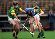 30 October 2000; Paul O'Grady of Patrickswell is challenged by Brendan Dunne of Toomevara during the AIB Munster Club Hurling Championship match between Patrickswell and Toomevara at Semple Stadium in Thurles, Tipperary. Photo by Ray McManus/Sportsfile