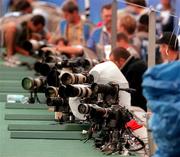 23 September 2000; Photographers set up remote cameras for the final of the Men's 100m. Stadium Australia, Sydney Olympic Park, Homebush Bay, Sydney, Australia. Photo by Brendan Moran/Sportsfile