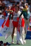 25 September 2000; Japan's Naoko Takahasi celebrates after winning gold in the womens marathon during the Sydney Olympics at Sydney Olympic Park in Sydney, Australia. Photo by Brendan Moran/Sportsfile