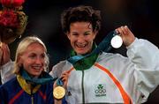 25 September 2000; Gold Medallist Gabriela Szabo of Romania, left, and Silver Medallist Sonia O'Sullivan of Ireland after the womens 10,000 final during the Sydney Olympics at Sydney Olympic Park in Sydney, Australia. Photo by Brendan Moran/Sportsfile