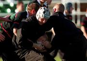 4 December 2000; Malcolm O'Kelly is tackled by Peter Clohessy and Peter Stringer during training at the ALLSA Sportsgrounds in Dublin Airport, Dublin. Photo by Aoife Rice/Sportsfile