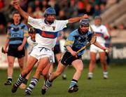 8 October 2000; Paddy O'Brien of UCD in action against Paddy Roberts of St Vincents during the Dublin Senior Hurling A Championship Final match between University College Dublin and St Vincents at Parnell Park in Dublin. Photo by Ray Lohan/Sportsfile