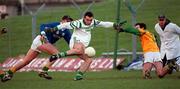 26 November 2000; Fermanagh's Stephen Maguire shots to score his sides first goal despite the attentions of Meath goalkeeper Cormac Sullivan during the Allianz National Football League Division 1B match between Meath and Fermanagh at Pairc Tailteann in Navan. Photo by Aoife Rice/Sportsfile