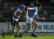 26 November 2000; Tomas Dermody of Graigue Ballycallan is tackled by Colm Hegarty of UCD during the AIB Leinster Senior Hurling Championship Final between Graigue Ballycallan and University College Dublin at Nowlan Park in Kilkenny. Photo by Ray McManus/Sportsfile