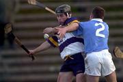 26 November 2000; Pat Fitzgerald of UCD is tackled by Graigue Ballycallan corner back Johnny Butler during the AIB Leinster Senior Hurling Championship Final between Graigue Ballycallan and University College Dublin at Nowlan Park in Kilkenny. Photo by Ray McManus/Sportsfile