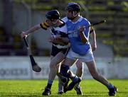 26 November 2000; Hugh Flannery of UCD is tackled by John Hoyne of Graigue Ballycallan during the AIB Leinster Senior Hurling Championship Final between Graigue Ballycallan and University College Dublin at Nowlan Park in Kilkenny. Photo by Ray McManus/Sportsfile