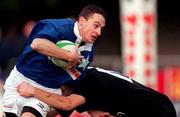 2 December 2000; Alan Conboy of St Mary's is tackled by Mike Lynch of Young Munster during the AIB League Division 1 match betweem St Mary's College and Young Munster at Templeville Road in Dublin. Photo by Brendan Moran/Sportsfile