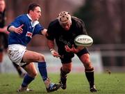 2 December 2000; Mike Mullins of Young Munster gets away from Alan Conboy of St Mary's College during the AIB League Division 1 match betweem St Mary's College and Young Munster at Templeville Road in Dublin. Photo by Brendan Moran/Sportsfile