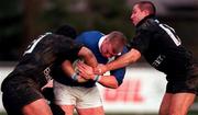 2 December 2000; Victor Costello of St Mary's is tackled by Muto Ngaracrimu, left, and Leo Doyle of Young Munster during the AIB League Division 1 match betweem St Mary's College and Young Munster at Templeville Road in Dublin. Photo by Brendan Moran/Sportsfile