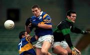 3 December 2000; Glenflesk fullback Michael O'Donoghue, centre, attempts to field a dropping ball from team-mate Ollie Favier, 7, and Derek Kavanagh of Nemo Rangers during the AIB Munster Club Football Championship Final match between Nemo Rangers and Glenflesk at the Gaelic Grounds in Limerick. Photo by Brendan Moran/Sportsfile