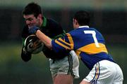 3 December 2000; Derek Kavanagh of Nemo Rangers holds off the challenge of Ollie Favier of Glenflesk during the AIB Munster Club Football Championship Final match between Nemo Rangers and Glenflesk at the Gaelic Grounds in Limerick. Photo by Brendan Moran/Sportsfile
