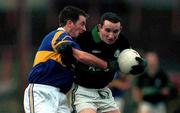 3 December 2000; Sean O'Brien of Nemo Rangers holds off the challenge of John O'Sullivan of Glenflesk during the AIB Munster Club Football Championship Final match between Nemo Rangers and Glenflesk at the Gaelic Grounds in Limerick. Photo by Brendan Moran/Sportsfile