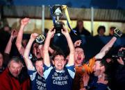 3 December 2000; Niall English of O'Hanrahans lifts the Sean McCabe Cup following AIB Leinster Club Football Championship Final match between O'Hanrahans and Na Fianna at O'Moore Park in Portlaoise. Photo by; David Maher/Sportsfile