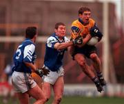 3 December 2000; Kieran McGeeney of Na Fianna in action against Breffni Hannon, left, and Philip Nolan of O'Hanrahans during AIB Leinster Club Football Championship Final match between O'Hanrahans and Na Fianna at O'Moore Park in Portlaoise. Photo by; David Maher/Sportsfile