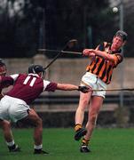 3 December 2000; Michael Hoyne of Kilkenny clears under pressure from Cathal Moore of Galway during the 1999 Oireachtas Hurling Final between Galway and Kilkenny in Nenagh, Tipperary. Photo by Ray McManus/Sportsfile