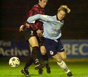 8 December 2000; Mark Hutchison of Shelbourne is tackled by Darren O'Keefe of Bohemians during the Eircom League Premier Division match between Bohemians and Shelbourne at Dalymount Park in Dublin. Photo by David Maher/Sportsfile