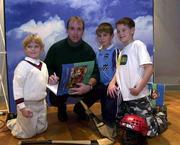 4 December 2000; Kilkenny hurling star DJ Carey with from left,Karl Corbett, 6, James Keating, 9 and Daniel Corbett, 10, Knocklyon, Dublin at the launch, in Chief O'Neill's hotel, Smithfield, Dublin, of &quot;A Season of Sunday's 2000&quot;, which is published by SPORTSFILE in association with Aer Lingus. Football, Hurling. Picture credit; Brendan Moran/SPORTSFILE *(EDI)*