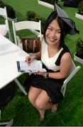 12 September 2015; Cherry He from Singapore enjoys a day at the races while on  her scholarship studying in Dublin. Irish Champions Weekend. Leopardstown, Co. Dublin.  Picture credit: Cody Glenn / SPORTSFILE
