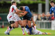 12 September 2015; Eoghan Clarke, Leinster, is tackled by Joseph Finnegan, left, Matthew Agnew and Michael Lowry, right, Ulster. Schools Interprovincial Rugby Championship, Round 2, Ulster v Leinster, Belfast Harlequins RFC, Deramore Park, Belfast, Co. Antrim. Picture credit: Seb Daly / SPORTSFILE