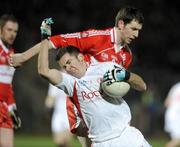 28 March 2009; Philip Jordan, Tyrone, in action against Enda Muldoon, Derry. Allianz GAA NFL Division 1 Round 6, Healy Park, Omagh, Co. Tyrone. Picture credit: Oliver McVeigh / SPORTSFILE