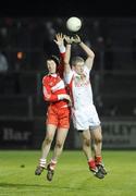 28 March 2009; Kevin Hughes, Tyrone, in action against Barry McGoldrick, Derry. Allianz GAA NFL Division 1 Round 6, Healy Park, Omagh, Co. Tyrone. Picture credit: Oliver McVeigh / SPORTSFILE