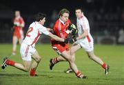 28 March 2009; Sean Leo McGoldrick, Derry, in action against PJ Quinn, Tyrone. Allianz GAA NFL Division 1 Round 6, Healy Park, Omagh, Co. Tyrone. Picture credit: Oliver McVeigh / SPORTSFILE