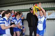 27 March 2009; St. Josephs captain Katie McAuliffe brings the cup to her team-mates. Pat the Baker Post Primary Schools Senior C Final, St Josephs, Abbeyfeale v Scoil Muire agus Padraig, Swinford, St Rynaghs, Banagher, Co. Offaly. Picture credit: Brian Lawless / SPORTSFILE