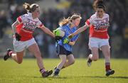 27 March 2009; Siobhan Tully, Convent of Mercy, in action against Joanne O'Brien, left, and Clare Gleeson, Loretto. Pat the Baker Post Primary Schools Senior A Final, Loretto, Fermoy v Convent of Mercy, Roscommon, St Rynaghs, Banagher, Co. Offaly. Picture credit: Brian Lawless / SPORTSFILE