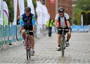 13 September 2015; The Irish Sports Council, in conjunction with Cycling Ireland teamed up with the Department of Transport, Tourism and Sport, Dublin City Council and Healthy Ireland for the Great Dublin Bike Ride which seen over 3,000 participants of all abilities from novice to expert ride 60km or 100km routes. Pictured is Ray D'Arcy, Television and Radio Presenter, left, as he cycles across the finish line. The Great Dublin Bike Ride. Smithfield Square, Dublin. Picture credit: Seb Daly / SPORTSFILE
