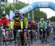 13 September 2015; The Irish Sports Council, in conjunction with Cycling Ireland teamed up with the Department of Transport, Tourism and Sport, Dublin City Council and Healthy Ireland for the Great Dublin Bike Ride which seen over 3,000 participants of all abilities from novice to expert ride 60km or 100km routes. Pictured is a general view of participants as they cycle under the start banner. The Great Dublin Bike Ride. Smithfield Square, Dublin. Picture credit: Seb Daly / SPORTSFILE
