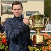 13 September 2015; Jockey Joseph O'Brien with the Vincent O'Brien National Stakes trophy after riding Air Force Blue to victory in the Goffs Vincent O`Brien National Stakes. Irish Champions Weekend. The Curragh, Co. Kildare. Picture credit: Cody Glenn / SPORTSFILE