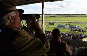 13 September 2015; Punters watch the finish of the final race of the weekend, the Irish Stallion Farms European Breeders Fund 'Northfields' Handicap. Irish Champions Weekend. The Curragh, Co. Kildare. Picture credit: Cody Glenn / SPORTSFILE