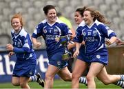 13 September 2015; Waterford players, from left, Brianna O'Regan, Jennie Simpson, Niamh Rockett and Molly Curran celebrate at the end of the game. All Ireland Intermediate Camogie Championship Final, Kildare v Waterford. Croke Park, Dublin. Picture credit: David Maher / SPORTSFILE