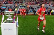 13 September 2015; Cork captain Ashling Thompson runs past the O'Duffy cup as she makes her way onto the pitch before the game. Liberty Insurance All Ireland Senior Camogie Championship Final, Cork v Galway. Croke Park, Dublin. Picture credit: Piaras Ó Mídheach / SPORTSFILE