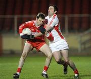 28 March 2009; Enda Muldoon, Derry, in action against Ryan Mellon, Tyrone. Allianz GAA NFL Division 1 Round 6, Healy Park, Omagh, Co. Tyrone. Picture credit: Oliver McVeigh / SPORTSFILE