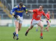 29 March 2009; Kevin Mulryan, Tipperary, in action against John O'Brien, Louth. Allianz GAA NFL Division 3, Round 6, Tipperary v Louth, Semple Stadium, Thurles, Co. Tipperary. Picture credit: Matt Browne / SPORTSFILE