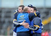 29 March 2009; Tipperary manager John Evans is congratulated by his players Niall Fitzgerald, left, and Sean Carey after the win against Louth. Allianz GAA NFL Division 3, Round 6, Tipperary v Louth, Semple Stadium, Thurles, Co. Tipperary. Picture credit: Matt Browne / SPORTSFILE