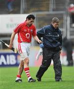 29 March 2009; Sean Og O hAilpin leaves the field with the Cork physio Declan O'Sullivan. Allianz GAA NHL Division 1, Round 5, Cork v Limerick, Pairc Ui Chaoimh, Cork. Picture credit: Ray McManus / SPORTSFILE