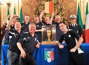 31 March 2009; Republic of Ireland supporters, from left to right, Kevin Marsh, Michael Ryan, Seamus Cooper, Declan Purcell, David English, Dermot Halpin, Derek White, Ben Harte, all from Villa FC, Waterford City, pictured with the FIFA World Cup Trophy, guarded by the municipal police, which is on display in Bari, ahead of the 2010 FIFA World Cup Qualifier against Italy on Wednesday. Republic of Ireland Fans in Italy, Bari, Italy. Picture credit: David Maher / SPORTSFILE