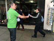 30 March 2009; Ray Houghton hands out ice creams on Grafton Street during the launch of Boylesports' supporters promotion for Irish fans travelling to Bari for the crunch group 8 game between the Republic of Ireland and the Azzurre. Boylesports, Grafton Street, Dublin. Picture credit: Pat Murphy / SPORTSFILE