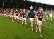 12 September 2015; Wexford captain Eoin Conroy leads his team during the pre-match parade. Bord Gais Energy GAA Hurling All-Ireland U21 Championship Final, Limerick v Wexford, Semple Stadium, Thurles, Co. Tipperary. Picture credit: Diarmuid Greene / SPORTSFILE