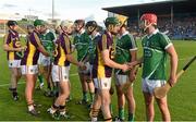 12 September 2015; Wexford's James Cash exchanges a handshake with Limerick's Barry Nash during the respect handshake before the game. Bord Gais Energy GAA Hurling All-Ireland U21 Championship Final, Limerick v Wexford, Semple Stadium, Thurles, Co. Tipperary. Picture credit: Diarmuid Greene / SPORTSFILE