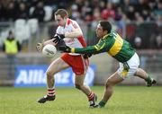 15 February 2009; Aidan Cassidy, Tyrone, in action against Declan O'Sullivan, Kerry. Allianz National Football League, Division 1, Round 2, Tyrone v Kerry, Healy Park, Omagh, Co. Tyrone. Picture credit: Oliver McVeigh / SPORTSFILE