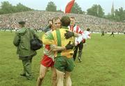 18 July 1993; Derry's John McGurk and Donegal's James McHugh after the final whistle. Ulster Senior Football Championship Final, Derry v Donegal, St. Tighearnach's Park, Clones, Co. Monaghan. Picture credit; Ray McManus / SPORTSFILE