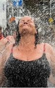 19 September 2015; Lisa Vaughan, from Liscannor, Co. Clare, showers off after taking part in the Dublin City Liffey Swim. Dublin City Liffey Swim. Dublin. Picture credit: Cody Glenn / SPORTSFILE